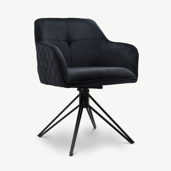 Black quilted armchair with swivel base on modern spider-frame legs